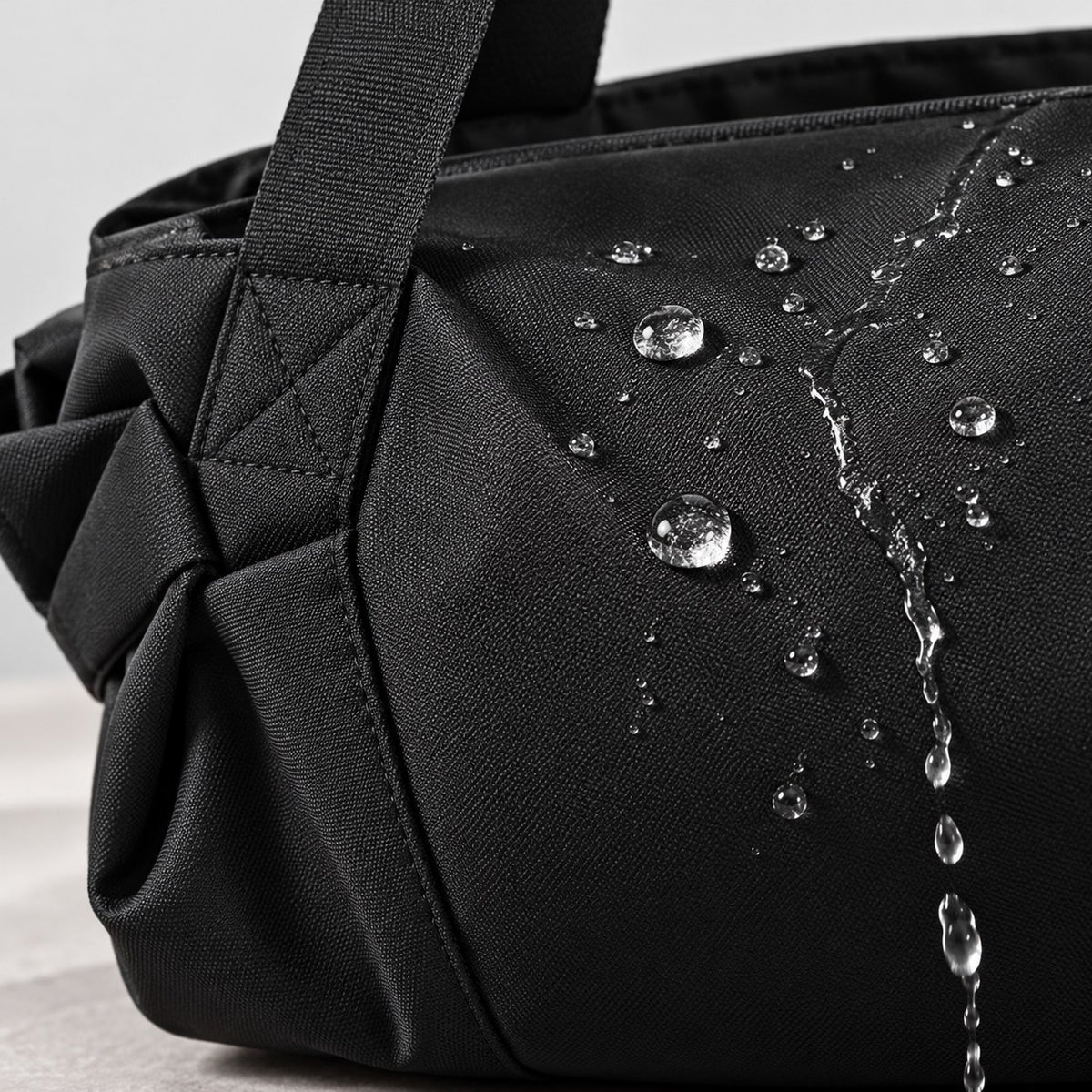 Water beading on the water-resistant black fabric