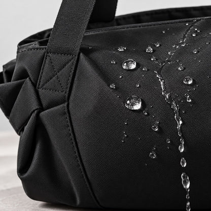 Water beading on the water-resistant black fabric